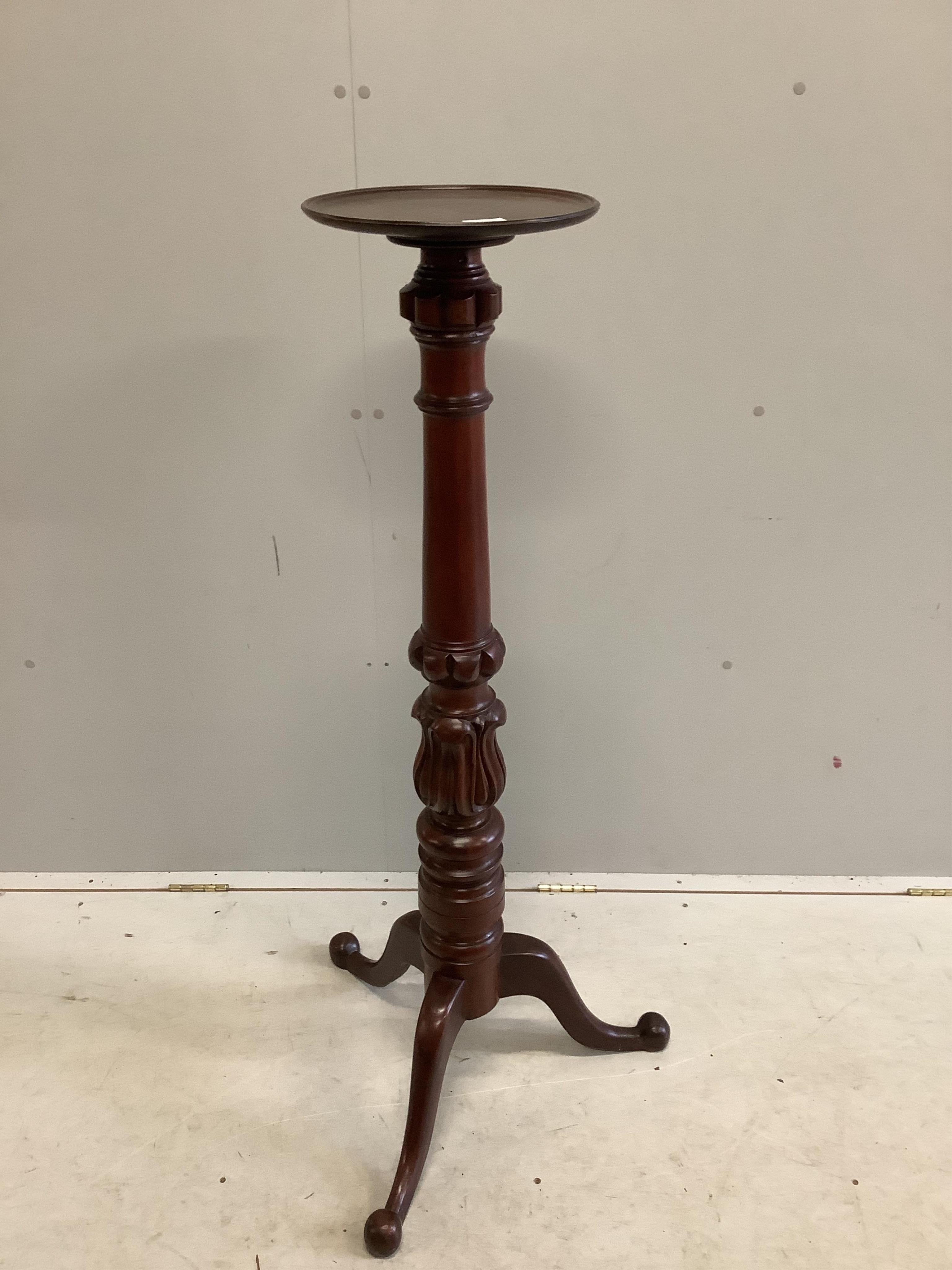 A Victorian style carved mahogany torchere, height 125cm. Condition - good